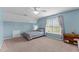 Tranquil bedroom with a cozy bed, soft lighting, and a large window, creating a relaxing retreat at 4810 Mitchell Mill Rd, Wake Forest, NC 27587