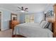 Comfortable bedroom with a large bed, dresser, and ample natural light from the windows at 4810 Mitchell Mill Rd, Wake Forest, NC 27587