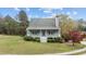 Charming single-Gathering home with a cozy front porch and landscaped front yard at 4810 Mitchell Mill Rd, Wake Forest, NC 27587