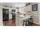 Well-lit kitchen featuring granite countertops, stainless steel appliances, and modern finishes at 4810 Mitchell Mill Rd, Wake Forest, NC 27587
