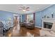 Comfortable living room with hardwood floors, fireplace, and plenty of natural light at 4810 Mitchell Mill Rd, Wake Forest, NC 27587