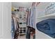 Well-organized walk-in closet with shelving and racks, providing ample storage space at 4810 Mitchell Mill Rd, Wake Forest, NC 27587