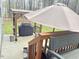 Outdoor patio with built in barbeque and umbrella covered seating area at 50 Teal Dr, Youngsville, NC 27596