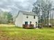 Backyard with a patio and pergola is great for entertaining or enjoying the peace of nature at 50 Teal Dr, Youngsville, NC 27596