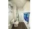 Bathroom featuring a walk-in shower, toilet, and towel rack at 50 Teal Dr, Youngsville, NC 27596