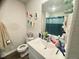 Bathroom featuring a toilet, sink with vanity, and painted wall decor at 50 Teal Dr, Youngsville, NC 27596