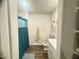 Bathroom featuring a toilet, sink with vanity, and a shower with curtain at 50 Teal Dr, Youngsville, NC 27596