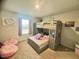 Bedroom featuring bunk beds, a window, and carpeted flooring at 50 Teal Dr, Youngsville, NC 27596