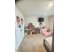 Bedroom featuring a dollhouse, tv, and carpeted flooring at 50 Teal Dr, Youngsville, NC 27596