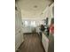 Modern kitchen featuring white cabinets, stainless appliances, and ample counter space at 50 Teal Dr, Youngsville, NC 27596