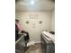 Functional laundry room offering space for washing, drying, and folding clothes at 50 Teal Dr, Youngsville, NC 27596