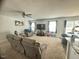Spacious living room with plush seating, ceiling fan, and access to the dining area at 50 Teal Dr, Youngsville, NC 27596
