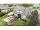 Aerial view of brick back exterior, screened deck and yard in a neighborhood at 5317 Serather Ct, Garner, NC 27529