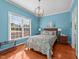 Bright bedroom with hardwood floors, large windows, and elegant furnishings at 5317 Serather Ct, Garner, NC 27529