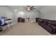 Spacious bonus room with carpet flooring, bar area, fan, and access to additional rooms at 5317 Serather Ct, Garner, NC 27529