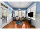 Cozy breakfast nook with a cushioned bench, round table, and bright windows at 5317 Serather Ct, Garner, NC 27529