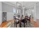 Dining area featuring hardwood floors, neutral walls, and lots of natural light at 5317 Serather Ct, Garner, NC 27529