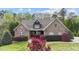 Charming brick home with manicured landscaping and a welcoming front entrance at 5317 Serather Ct, Garner, NC 27529