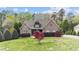Charming brick home with manicured lawn, mature trees, and inviting front entry at 5317 Serather Ct, Garner, NC 27529