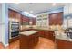 Spacious kitchen with stainless steel appliances, granite countertops, and an island at 5317 Serather Ct, Garner, NC 27529