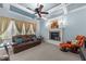 Cozy living room with fireplace, comfortable seating, and natural light at 5317 Serather Ct, Garner, NC 27529