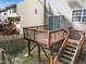 View of the deck looking down into the fenced in yard with patio sliding door at 5430 Crabtree Park Ct, Raleigh, NC 27612