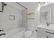 Bathroom features a shower-tub combo, floating shelves, and a vanity at 5430 Crabtree Park Ct, Raleigh, NC 27612