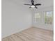Bright bedroom with laminate floors and two windows for natural light at 5430 Crabtree Park Ct, Raleigh, NC 27612