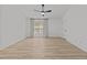 Spacious bedroom with neutral walls, a ceiling fan, and a large window at 5430 Crabtree Park Ct, Raleigh, NC 27612