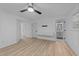 Bedroom with a ceiling fan, wood flooring, a walk-in closet, and an ensuite bathroom at 5430 Crabtree Park Ct, Raleigh, NC 27612
