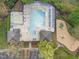 Aerial view of community amenities showing pool, spa, playground, and parking at 5430 Crabtree Park Ct, Raleigh, NC 27612