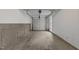 Attached garage with sealed concrete floors and overhead storage at 5430 Crabtree Park Ct, Raleigh, NC 27612