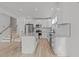 Bright kitchen features white cabinets, stainless steel appliances, and granite countertops at 5430 Crabtree Park Ct, Raleigh, NC 27612