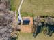 Aerial view of property showcasing home, long driveway, and surrounding grounds at 5570 Normans Rd, Rougemont, NC 27572