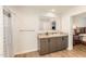Bathroom featuring a single vanity, a large mirror, and a shower with patterned curtain at 5570 Normans Rd, Rougemont, NC 27572