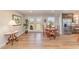 Inviting dining area with hardwood floors, a round wooden table, and direct access to the backyard through glass doors at 5570 Normans Rd, Rougemont, NC 27572