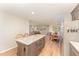 Modern kitchen with gray cabinets, stainless steel appliances and a central island at 5570 Normans Rd, Rougemont, NC 27572