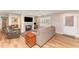 Comfortable living room with a stone fireplace, hardwood floors, and ample seating, perfect for relaxing and entertaining at 5570 Normans Rd, Rougemont, NC 27572