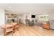 Open-concept living area with a modern kitchen, cozy dining space, and a comfortable living room with fireplace at 5570 Normans Rd, Rougemont, NC 27572