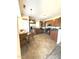 Open kitchen with wooden cabinets, stainless steel appliances, and a dining area, creating a functional and inviting space at 6320 Slopeside Ct, Raleigh, NC 27610