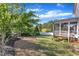 Spacious backyard with lush grass, a privacy fence and a screened in porch at 706 Fireball Ct, Knightdale, NC 27545