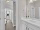 Bright bathroom showcasing a clean aesthetic with white cabinetry and modern fixtures at 706 Fireball Ct, Knightdale, NC 27545