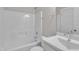 Functional bathroom featuring a shower-tub combo and a single sink vanity with ample counter space at 706 Fireball Ct, Knightdale, NC 27545