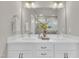 Bathroom featuring a double sink vanity and large mirror, perfect for busy mornings at 706 Fireball Ct, Knightdale, NC 27545