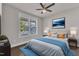 Bedroom with large window and ceiling fan at 706 Fireball Ct, Knightdale, NC 27545