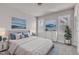 Bright bedroom featuring neutral walls, white trim, and two windows with natural light at 706 Fireball Ct, Knightdale, NC 27545