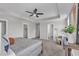 Bedroom featuring neutral walls, plush carpeting, and a modern ceiling fan at 706 Fireball Ct, Knightdale, NC 27545
