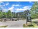 View of the community dog park entrance including fenced area and information signage at 706 Fireball Ct, Knightdale, NC 27545