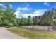Community dog park including a fenced in area and lush surroundings at 706 Fireball Ct, Knightdale, NC 27545