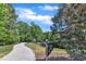 Community dog park featuring lush surroundings, walking path, and mature trees at 706 Fireball Ct, Knightdale, NC 27545